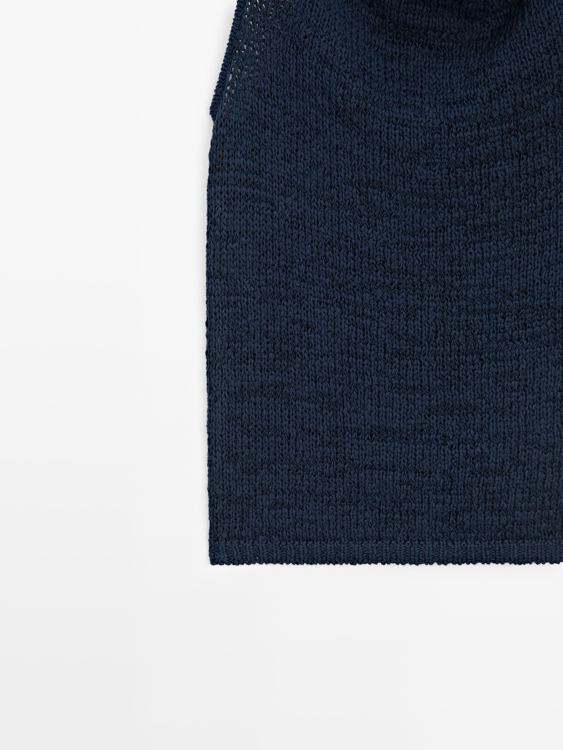 Knit top with draped neckline